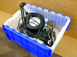 Sturdy tote with flip-style lid comes with a magnifying lamp with extendable arm, extension cords