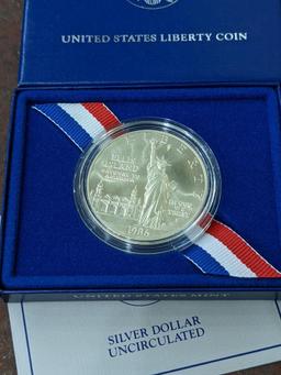 1986 The Liberty Silver Dollar Statue of Liberty Ellis Island coin with paper and box reading United