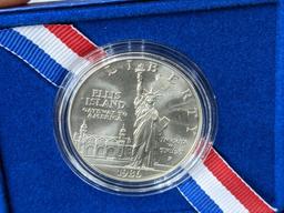 1986 The Liberty Silver Dollar Statue of Liberty Ellis Island coin with paper and box reading United