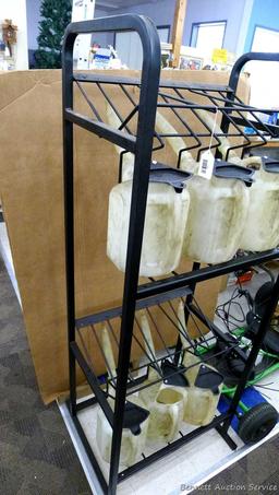Automotive fluid jug organizer rack has space for twelve jugs - comes with 6 six quart dispenser