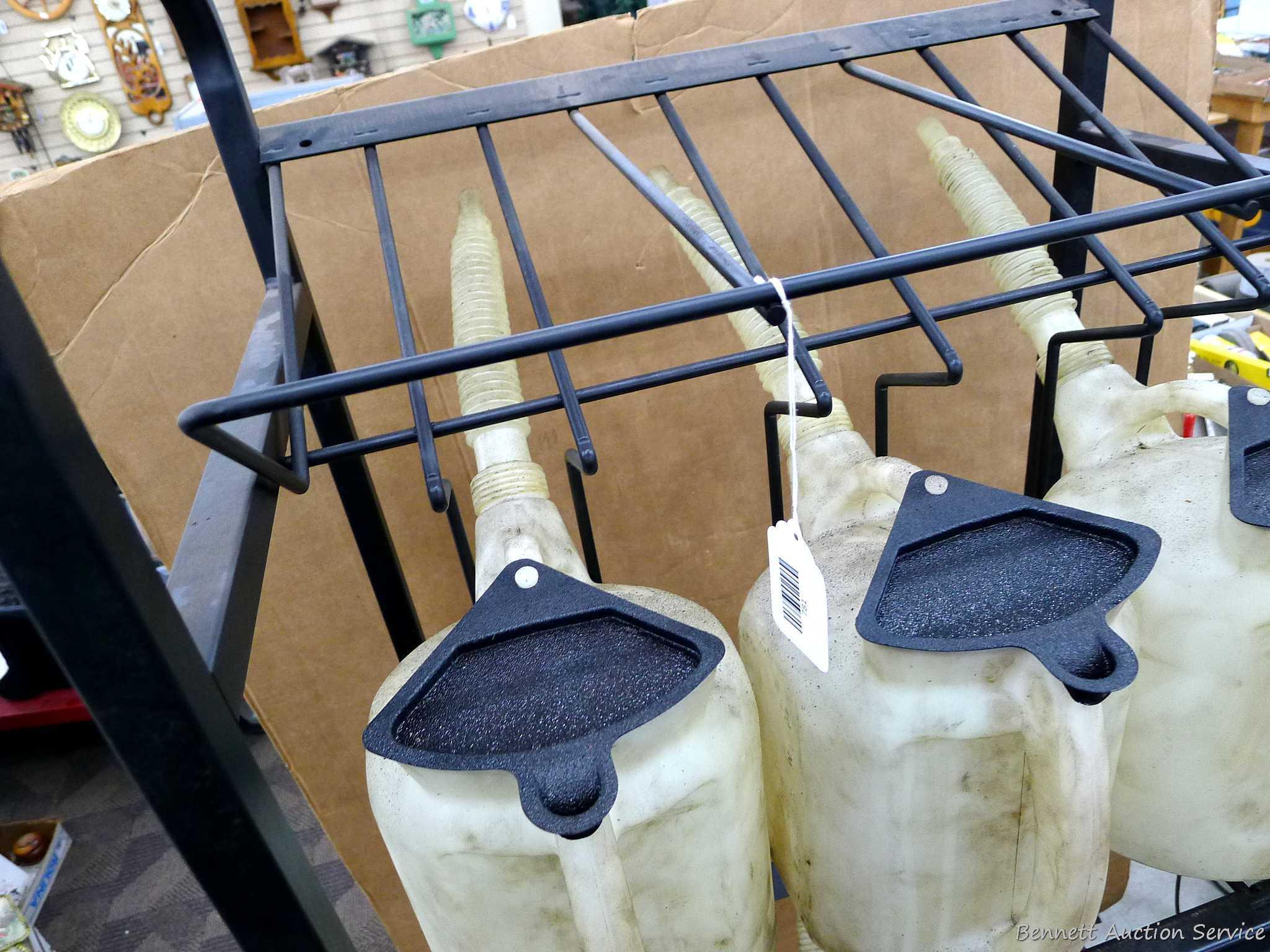 Automotive fluid jug organizer rack has space for twelve jugs - comes with 6 six quart dispenser