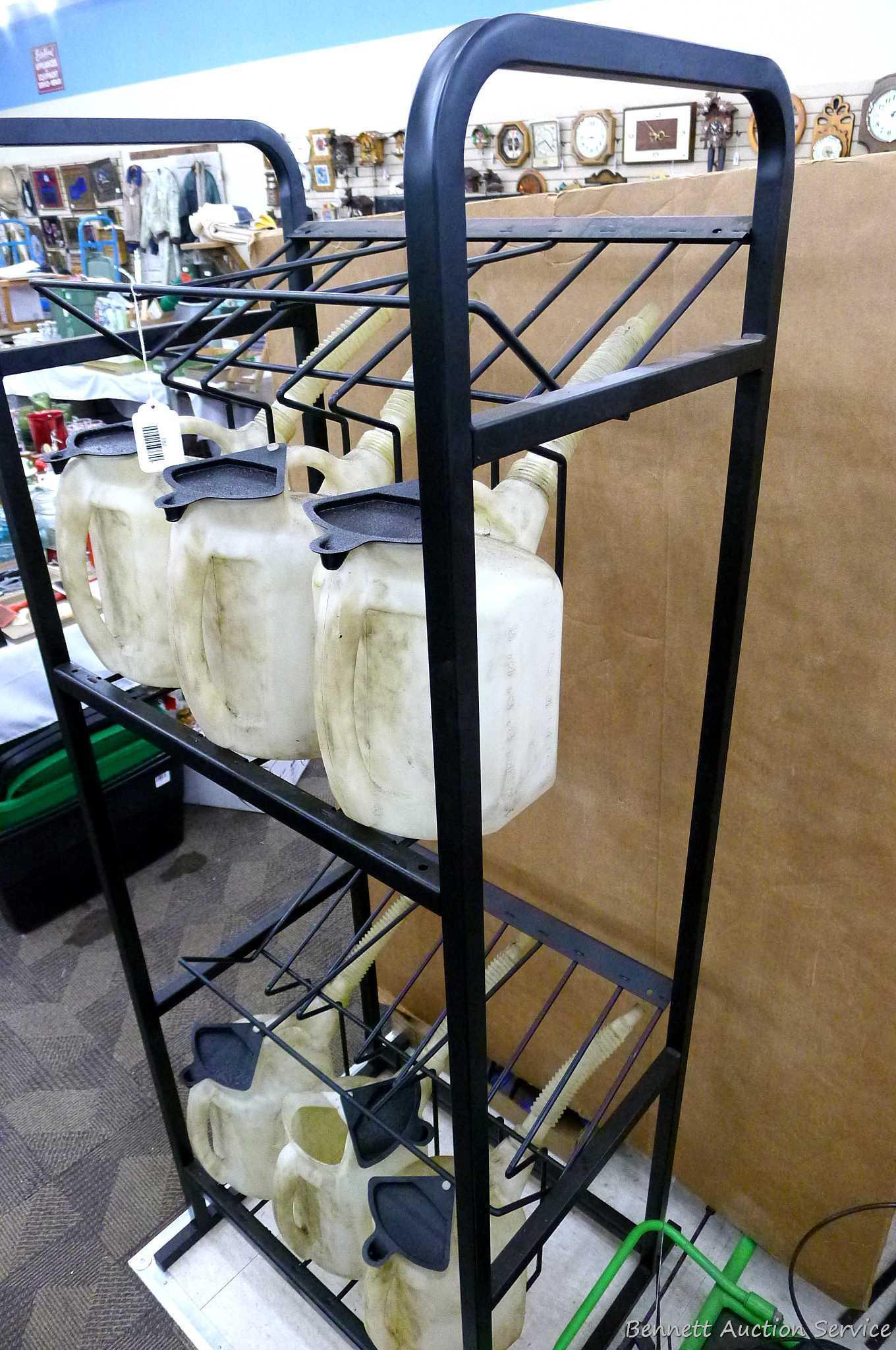 Automotive fluid jug organizer rack has space for twelve jugs - comes with 6 six quart dispenser