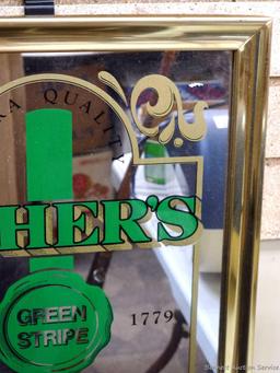 Ushers Green Stripe Scotch mirror is about 15" x 18" over frame. In good condition.