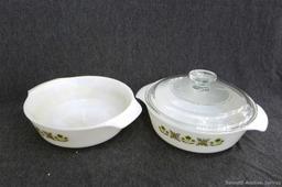 Cute Anchor Hocking dishes with matching pattern, and a couple of complimentary skillets. Largest