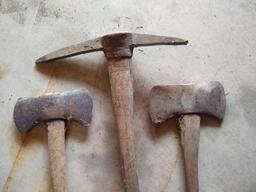 Two double bit axes and a double sided pick axe. Larger double bit axe has a 36" long handle and is