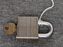 Pair of No. 4 brass Marine padlocks by Master Lock are keyed alike. About 2-1/4" long.