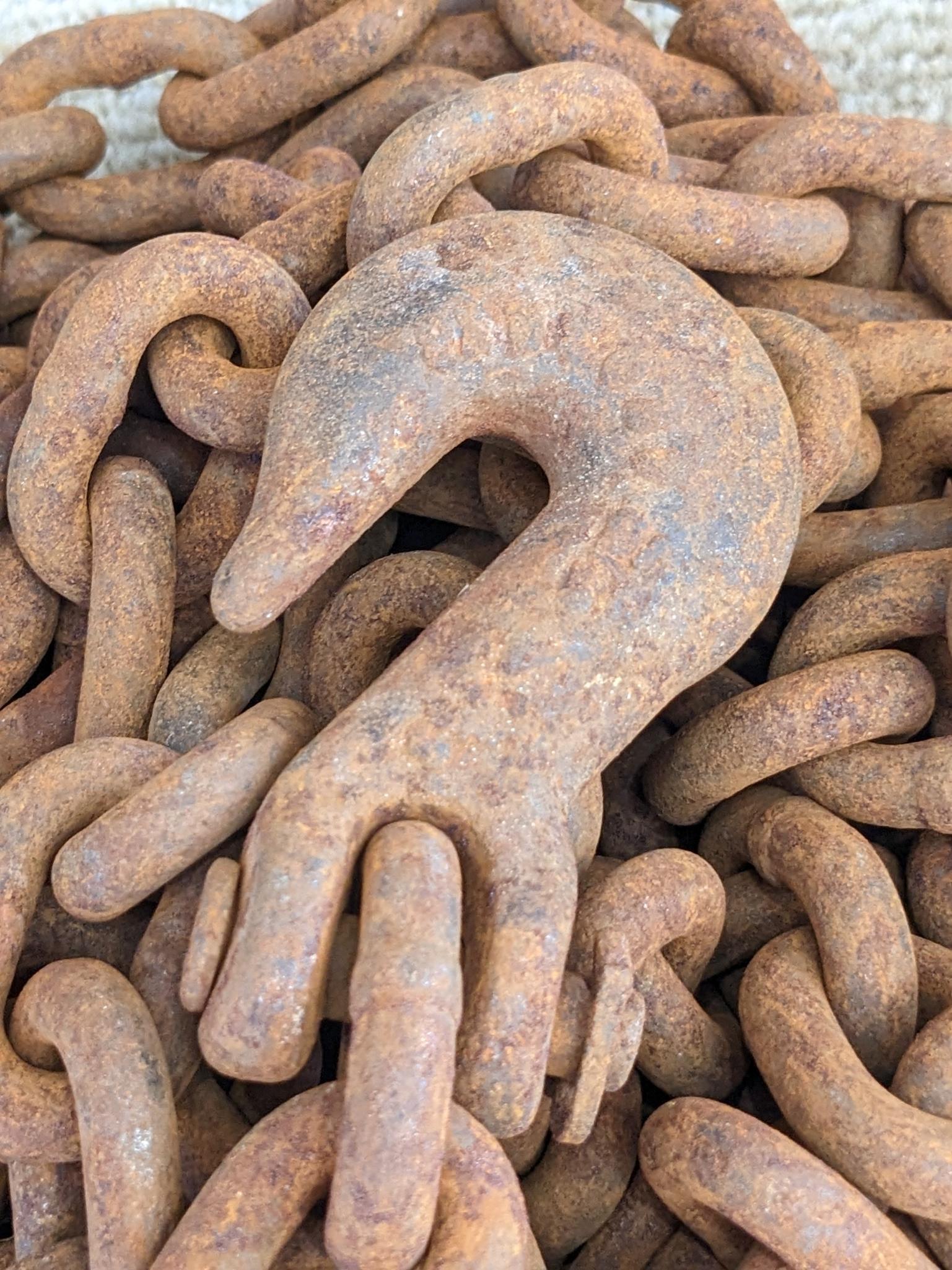 20' of 3/8" chain with 2 grab hooks, no repairs noted.