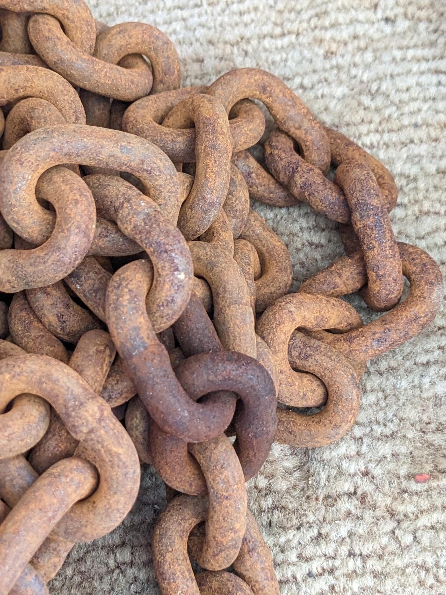 20' of 3/8" chain with 2 grab hooks, no repairs noted.