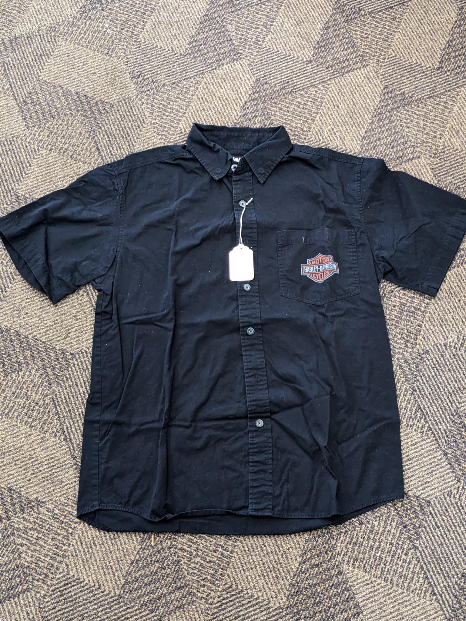 Two Harley-Davidson button-up shirts. Both appear in good condition and are sizes medium and large.
