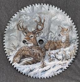 Painted saw blade are with two deer and painted by Carol Ahrens in 2013.