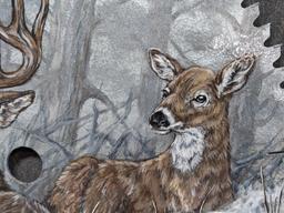 Painted saw blade are with two deer and painted by Carol Ahrens in 2013.