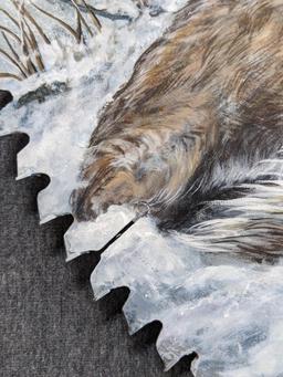 Painted saw blade are with two deer and painted by Carol Ahrens in 2013.