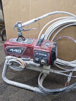 Titan Impact 440 paint sprayer comes with extra Titan reversible tips/seals and approx 45' of hose.