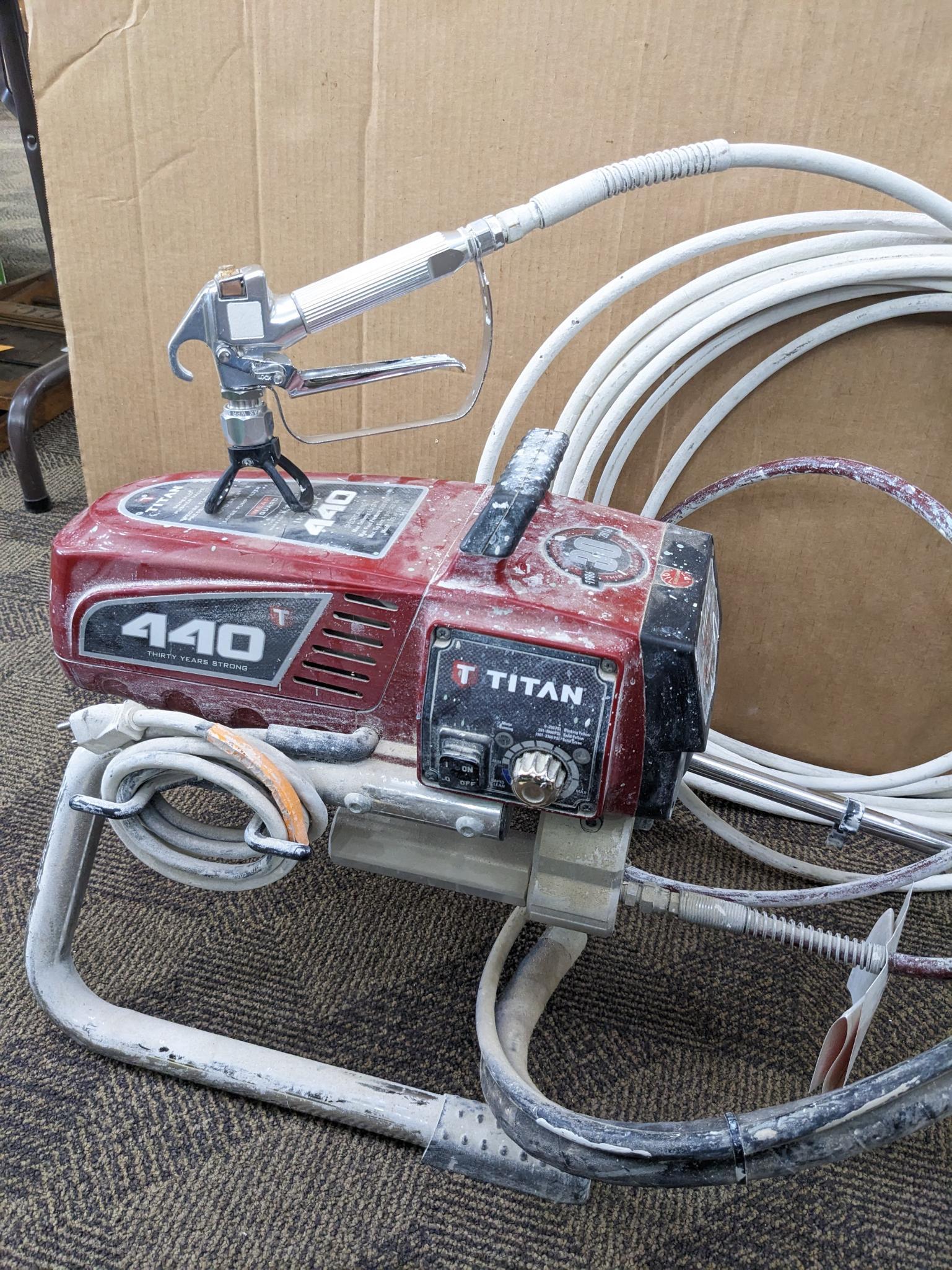 Titan Impact 440 paint sprayer comes with extra Titan reversible tips/seals and approx 45' of hose.
