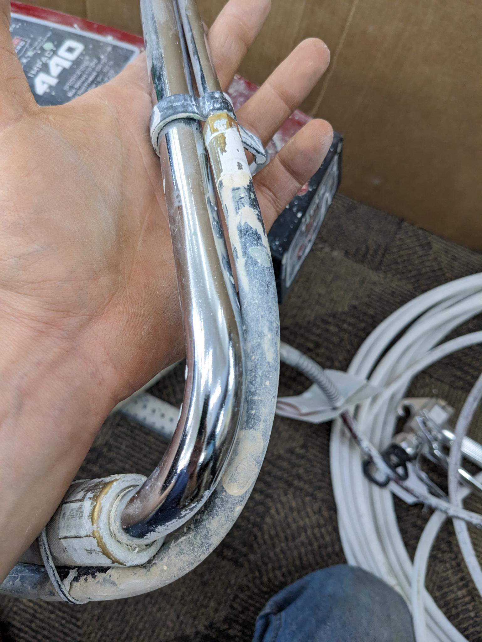 Titan Impact 440 paint sprayer comes with extra Titan reversible tips/seals and approx 45' of hose.