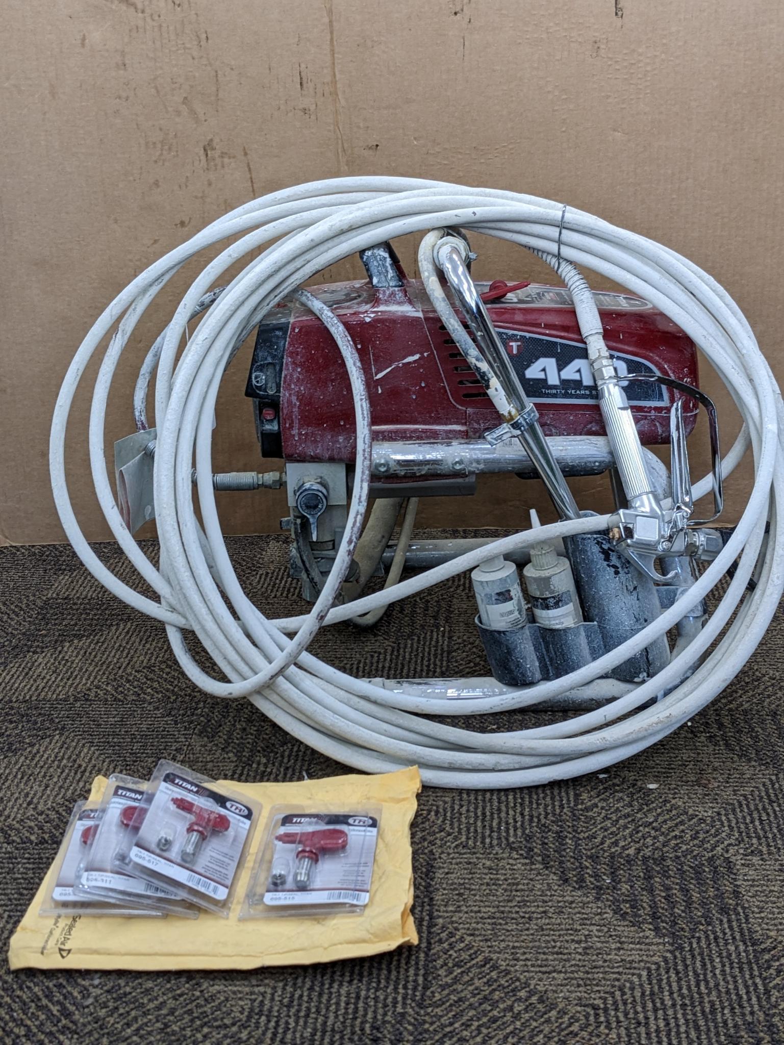 Titan Impact 440 paint sprayer comes with extra Titan reversible tips/seals and approx 45' of hose.