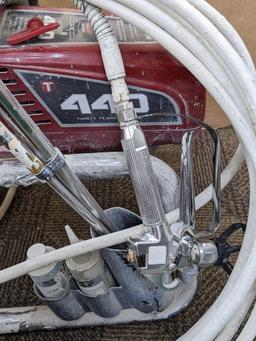 Titan Impact 440 paint sprayer comes with extra Titan reversible tips/seals and approx 45' of hose.