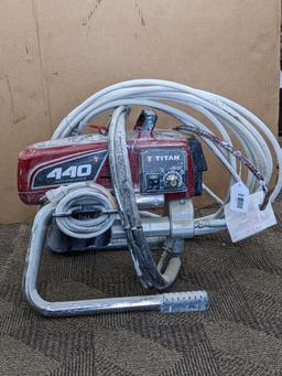 Titan Impact 440 paint sprayer comes with extra Titan reversible tips/seals and approx 45' of hose.