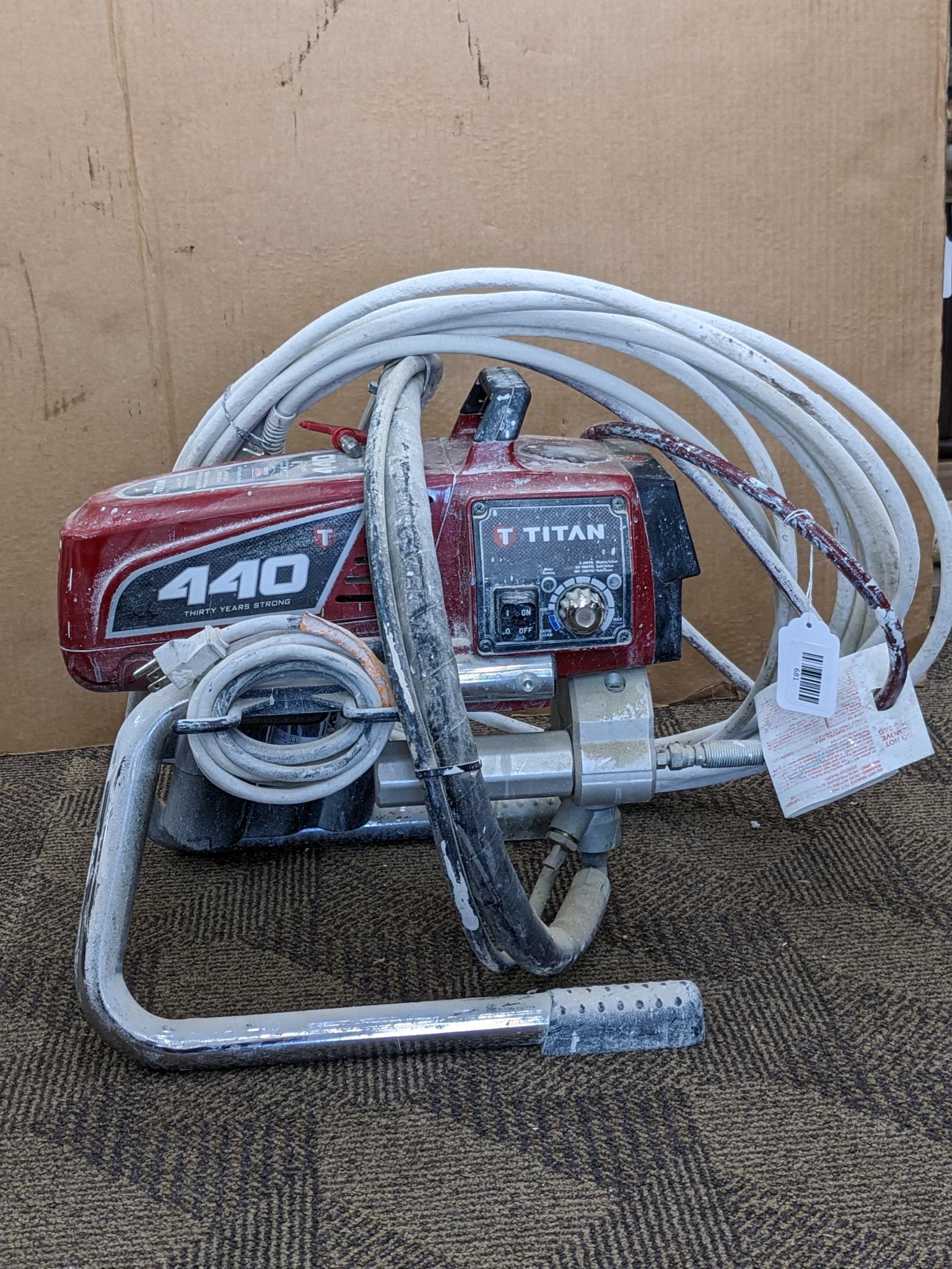 Titan Impact 440 paint sprayer comes with extra Titan reversible tips/seals and approx 45' of hose.