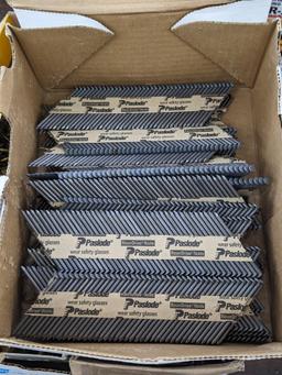 Partial box of Paslode 30 degree smooth shank nails, are 2-3/8" long.