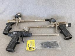 Three foam spraying guns, one labeled Great Stuff pro series 13, comes with four extra tips.