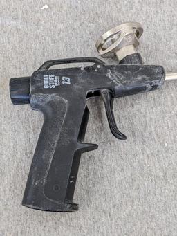 Three foam spraying guns, one labeled Great Stuff pro series 13, comes with four extra tips.