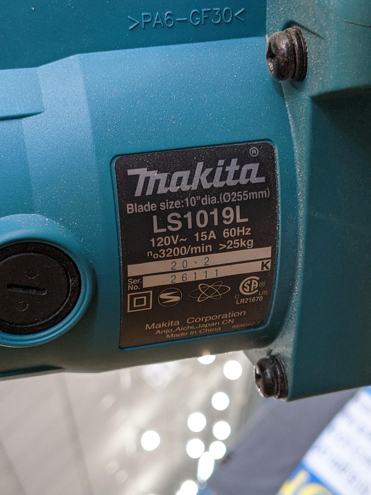 Makita sliding compound miter saw w/ laser guide, angle up to 60 degrees. Has dust bag, and comes on