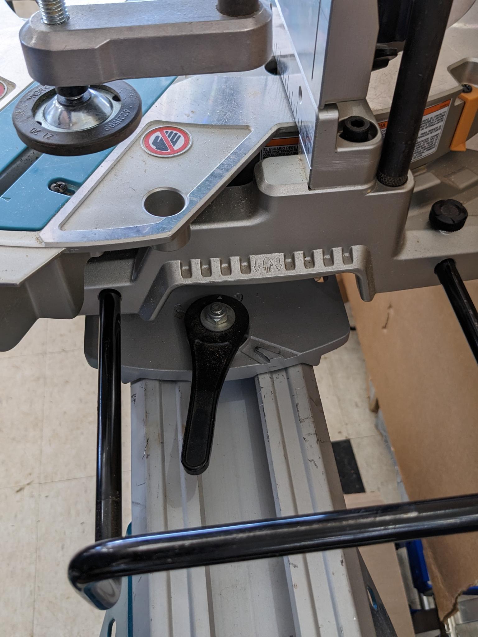 Makita sliding compound miter saw w/ laser guide, angle up to 60 degrees. Has dust bag, and comes on