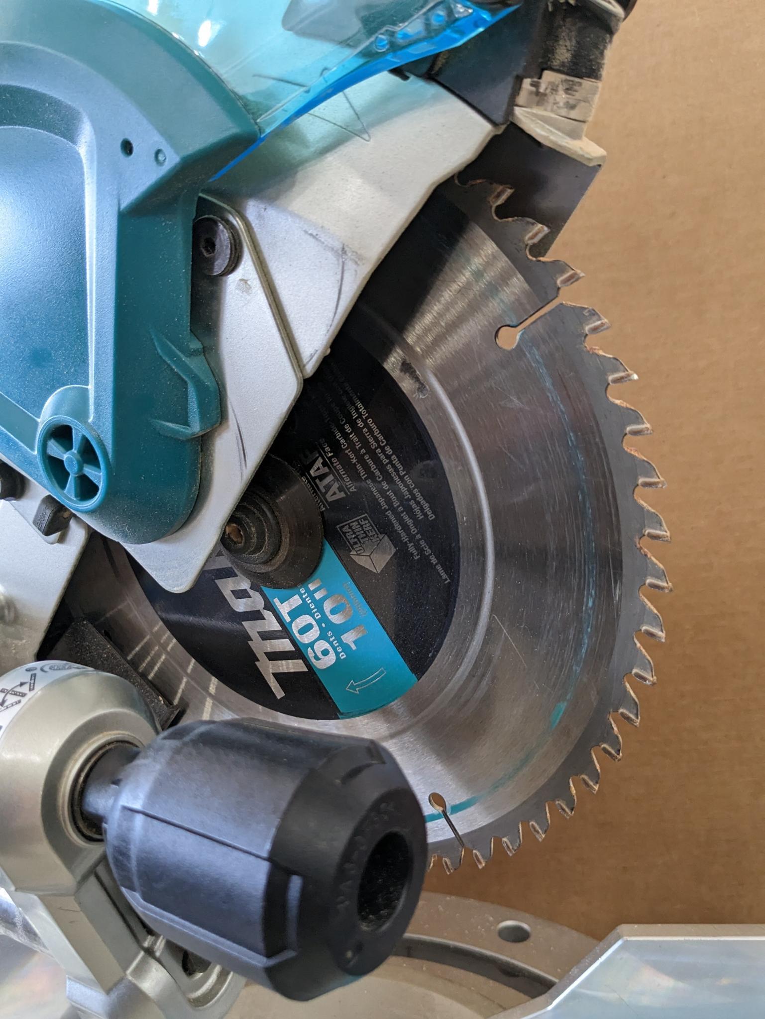 Makita sliding compound miter saw w/ laser guide, angle up to 60 degrees. Has dust bag, and comes on