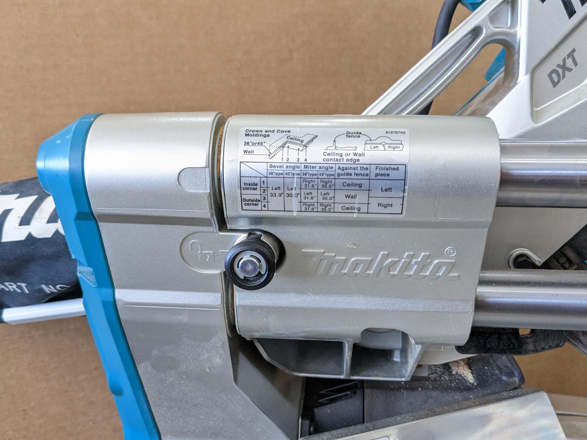 Makita sliding compound miter saw w/ laser guide, angle up to 60 degrees. Has dust bag, and comes on