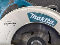 Makita magnesium 7 1/4" circular saw w/ blade guide, hard case, and original papers. Saw is in very