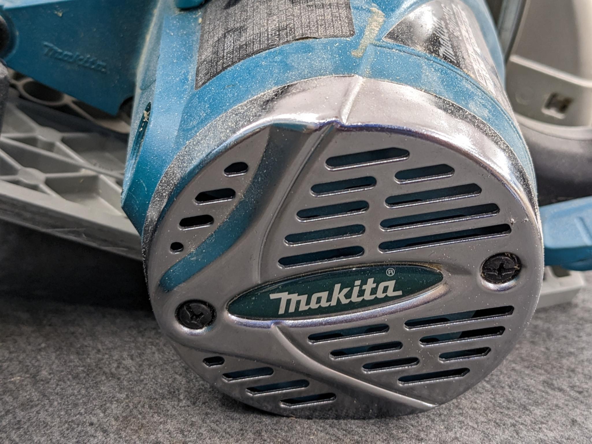 Makita magnesium 7 1/4" circular saw w/ blade guide, hard case, and original papers. Saw is in very