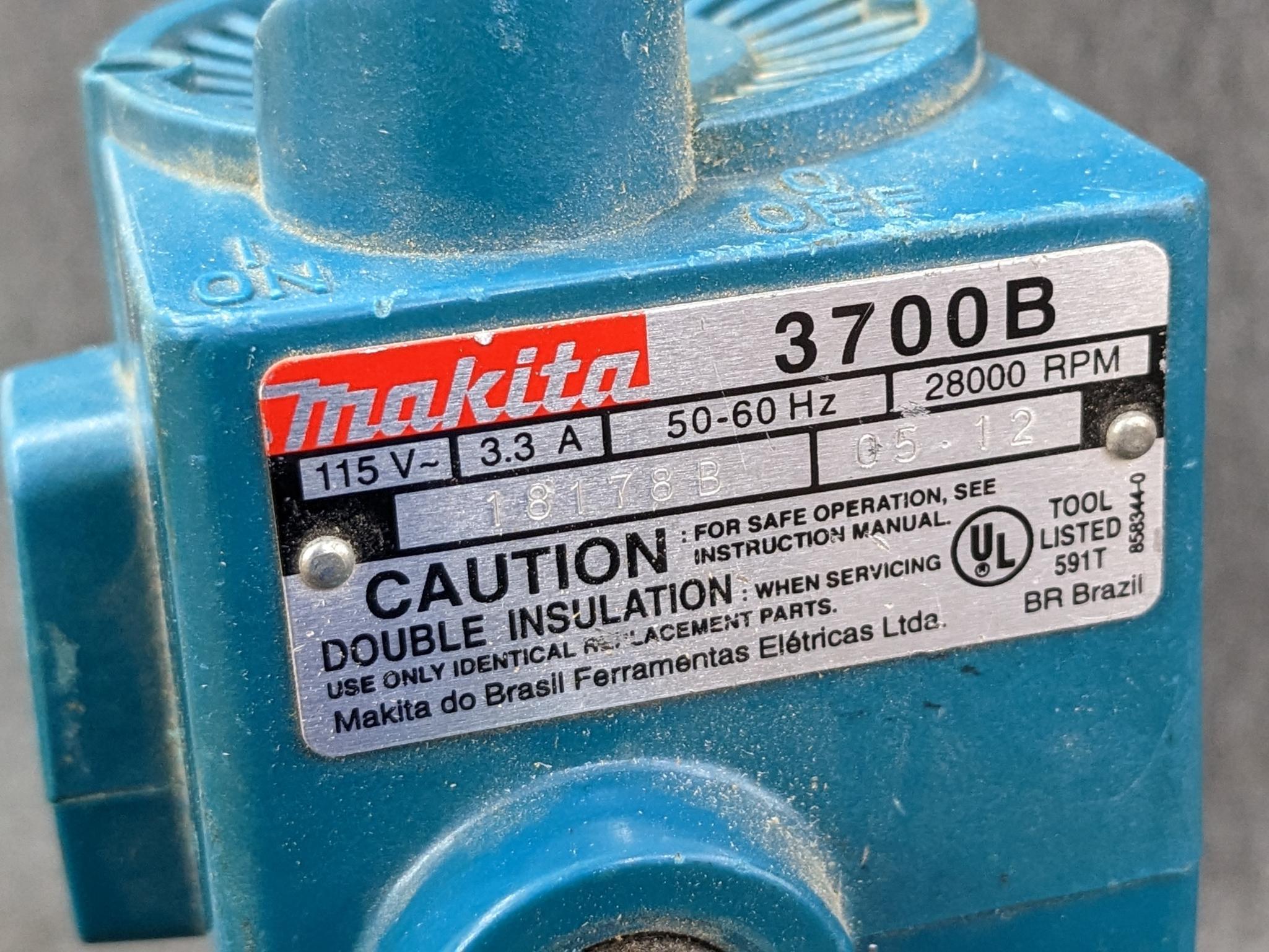 Makita 3700B trim router. runs up to 28,000 rpm. currently has 1/2" square-cut bit.