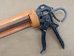 Two swiveling case caulk guns, one takes regular size tubes, other takes large. Both appear in good