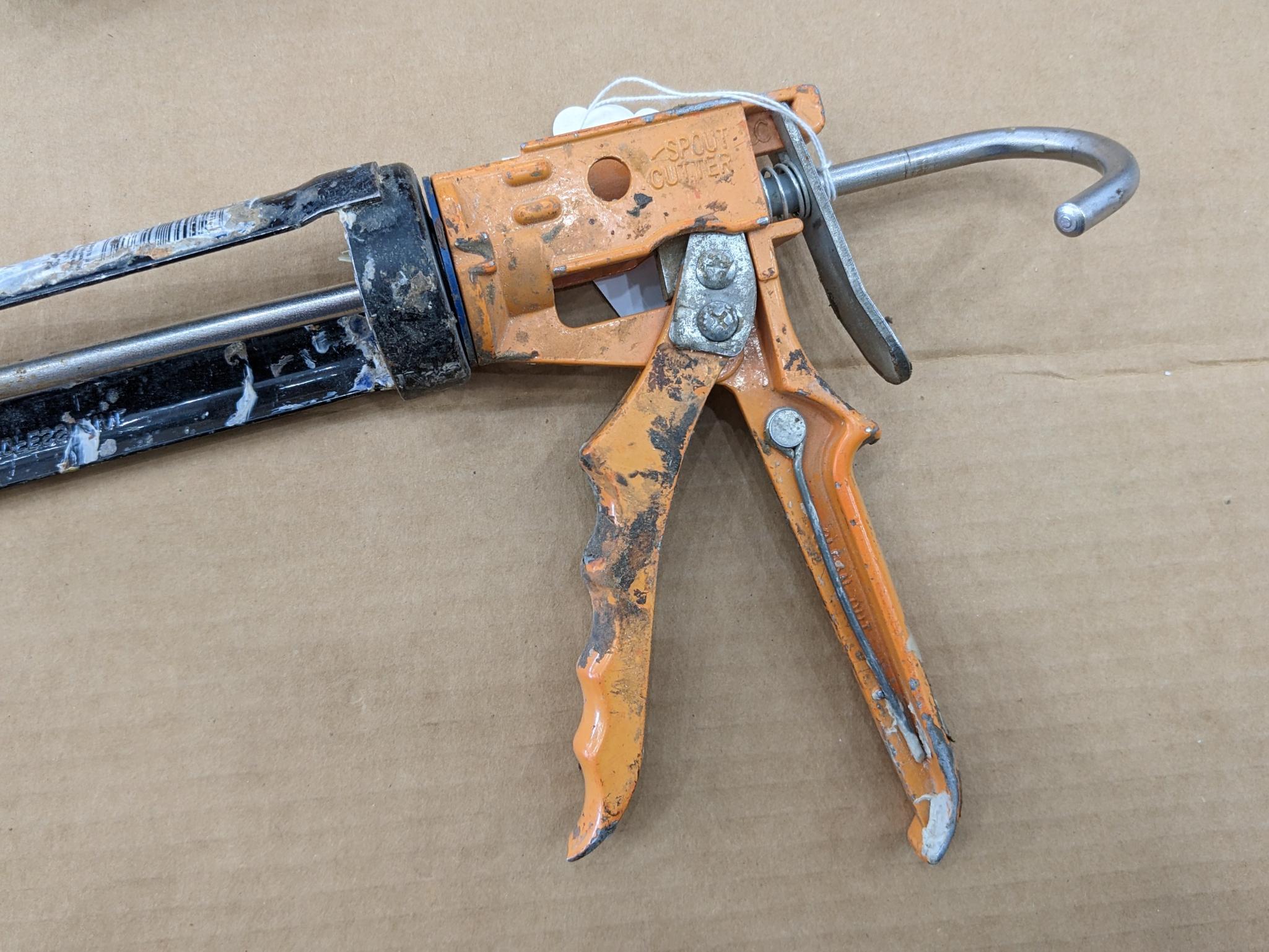 Two swiveling case caulk guns, one takes regular size tubes, other takes large. Both appear in good