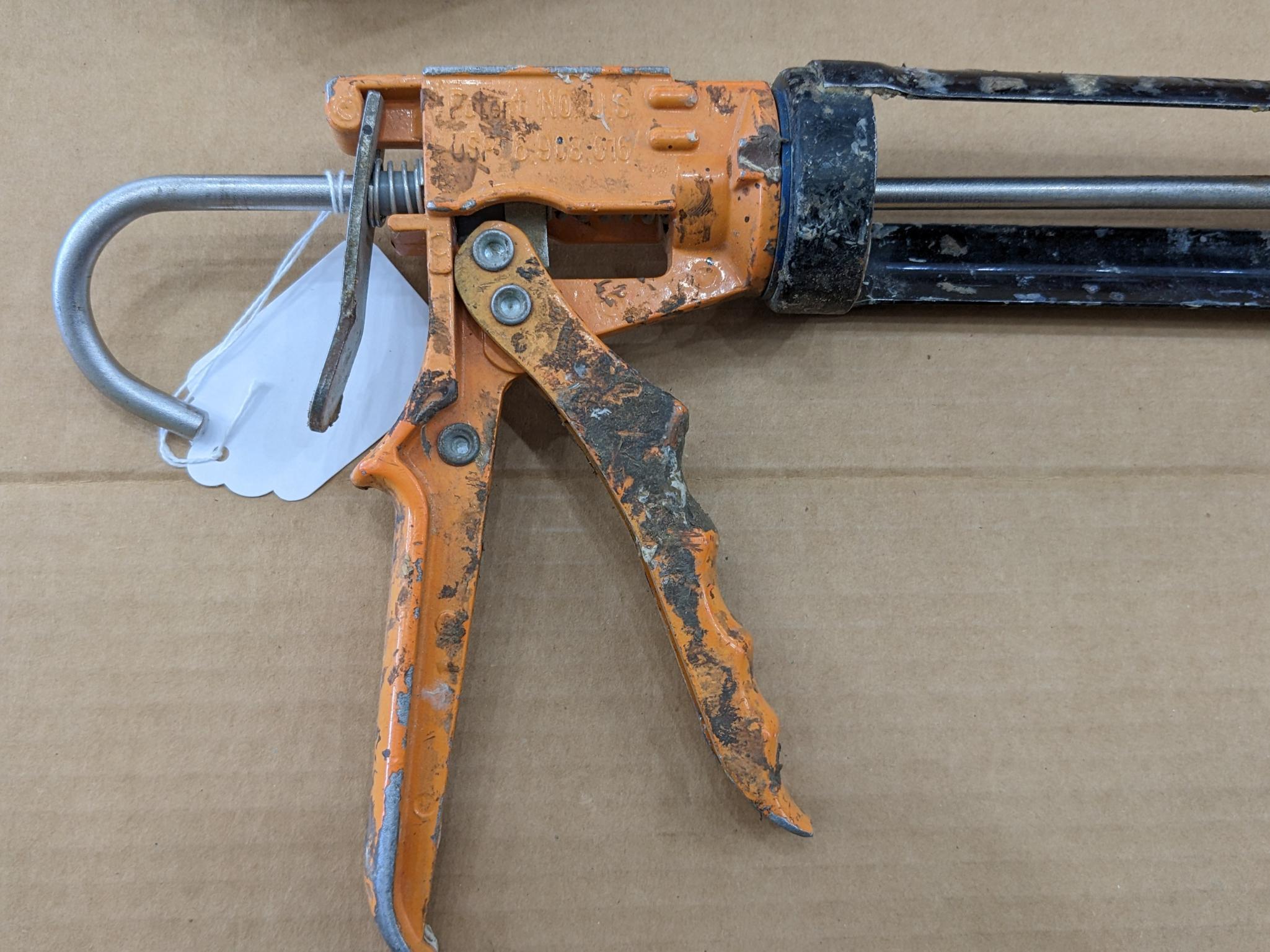 Two swiveling case caulk guns, one takes regular size tubes, other takes large. Both appear in good