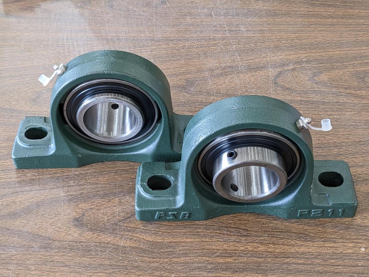 Pair of FSB pillow block bearing model no. P21 have 2" ID center race and outer grease zerk. Are new