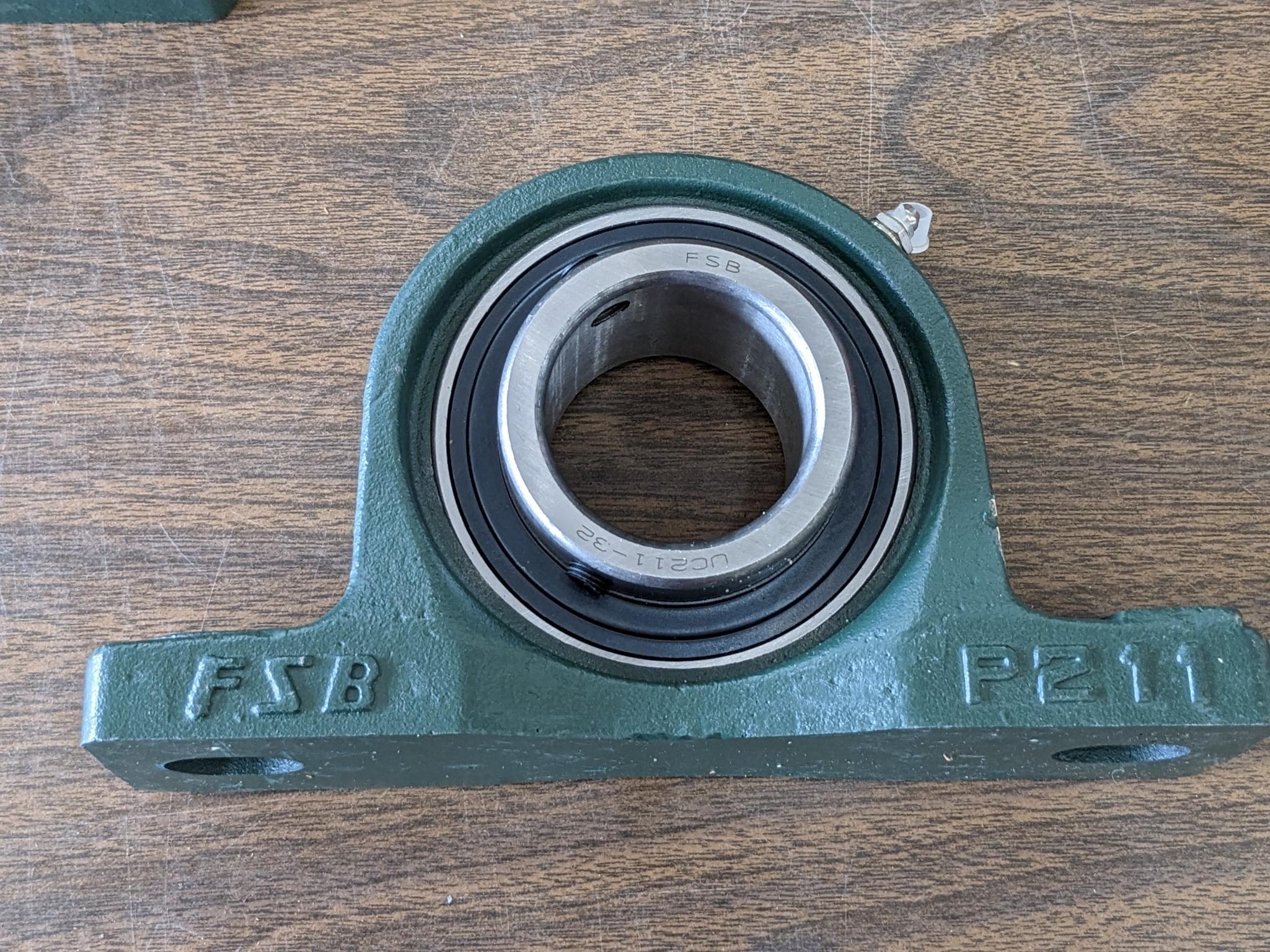 Pair of FSB pillow block bearing model no. P21 have 2" ID center race and outer grease zerk. Are new
