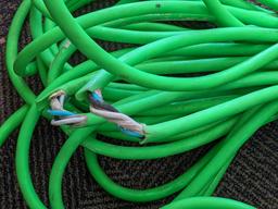 Two contractor extension cords. Notable tearing in outer insulation noted.