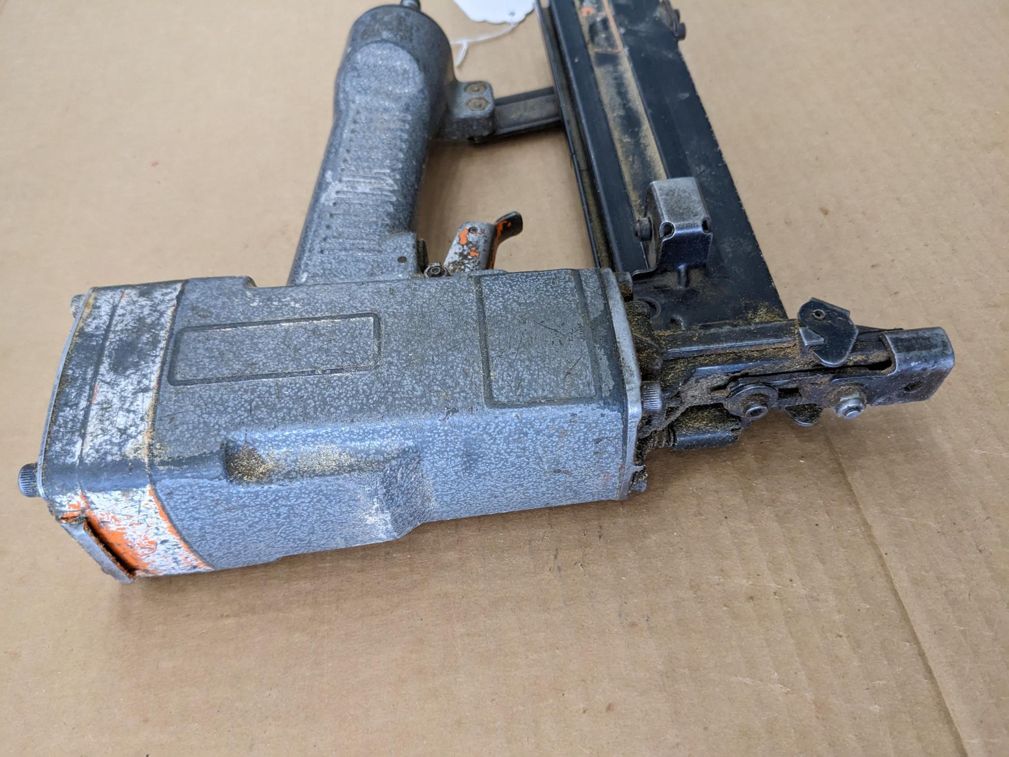Paslode pneumatic crown stapler, tags are missing but it looks to take staples up to 2" tall.