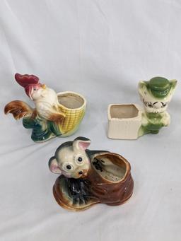 Several vintage planters would look great in your kitchen window. Pieces in overall nice condition