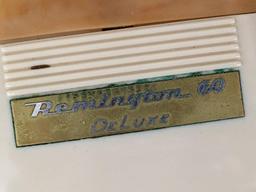 Remington 60 Deluxe electric shaver in original case; shaver measures 3" x 2-3/4".