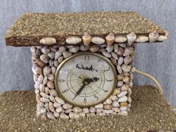 Interesting clock made with shells; measures 12" x 6-1/2" x 10-1/2" tall. Seller states it works and