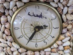 Interesting clock made with shells; measures 12" x 6-1/2" x 10-1/2" tall. Seller states it works and