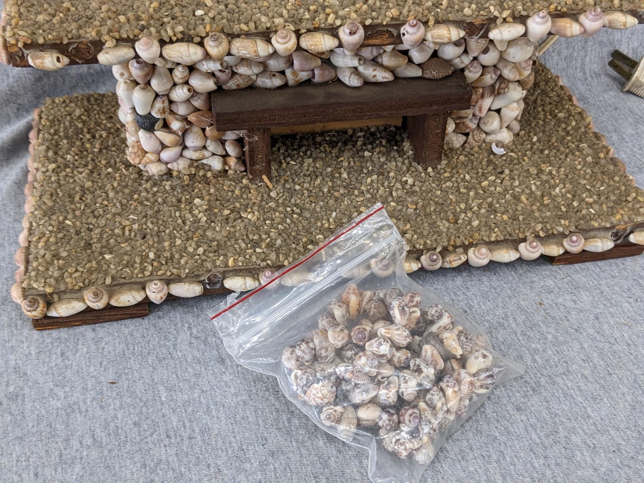 Interesting clock made with shells; measures 12" x 6-1/2" x 10-1/2" tall. Seller states it works and