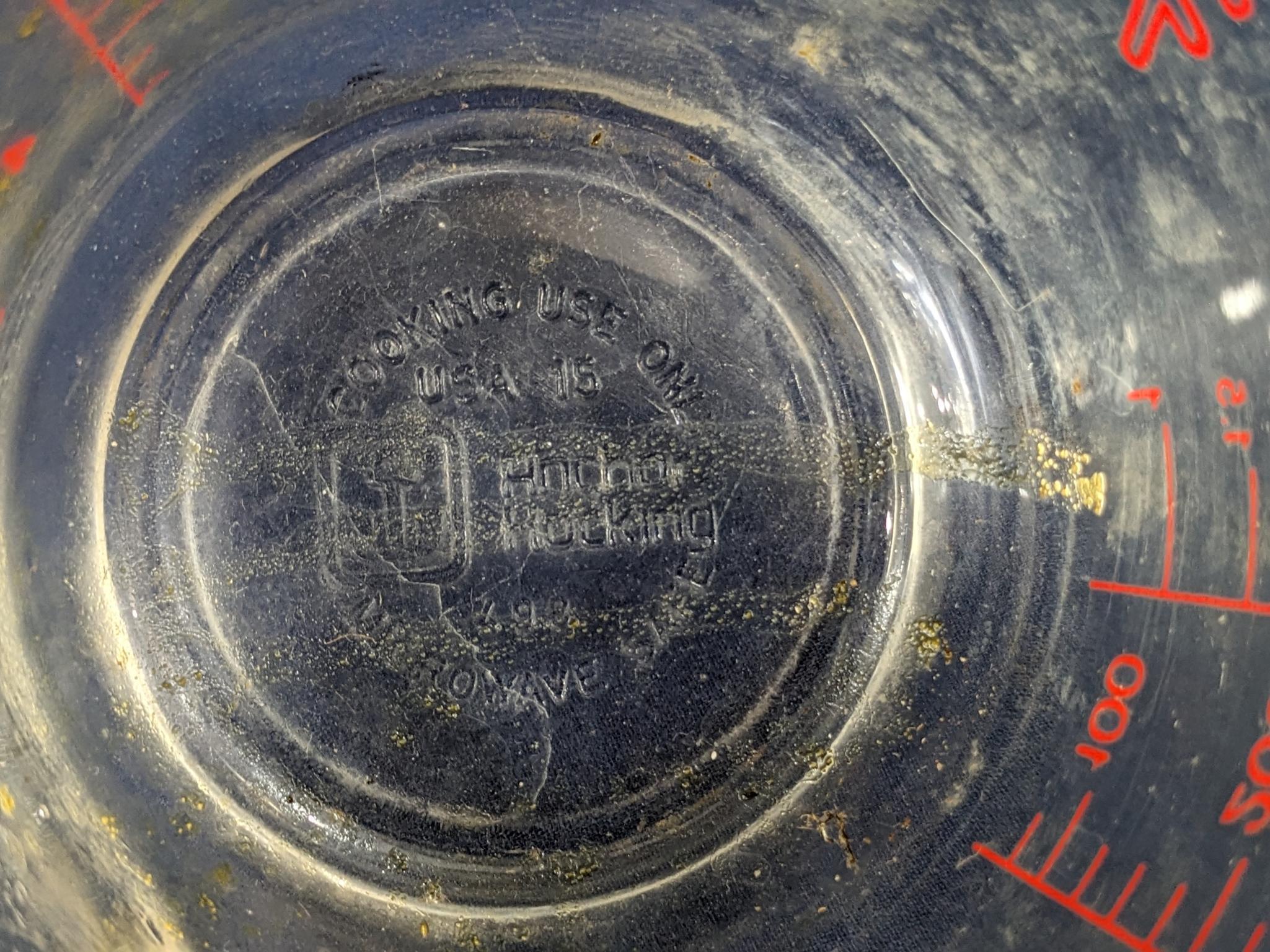 Set of 2 Fire King glass measuring cups include a 1 cup and 2 cup; larger measures 5" tall.