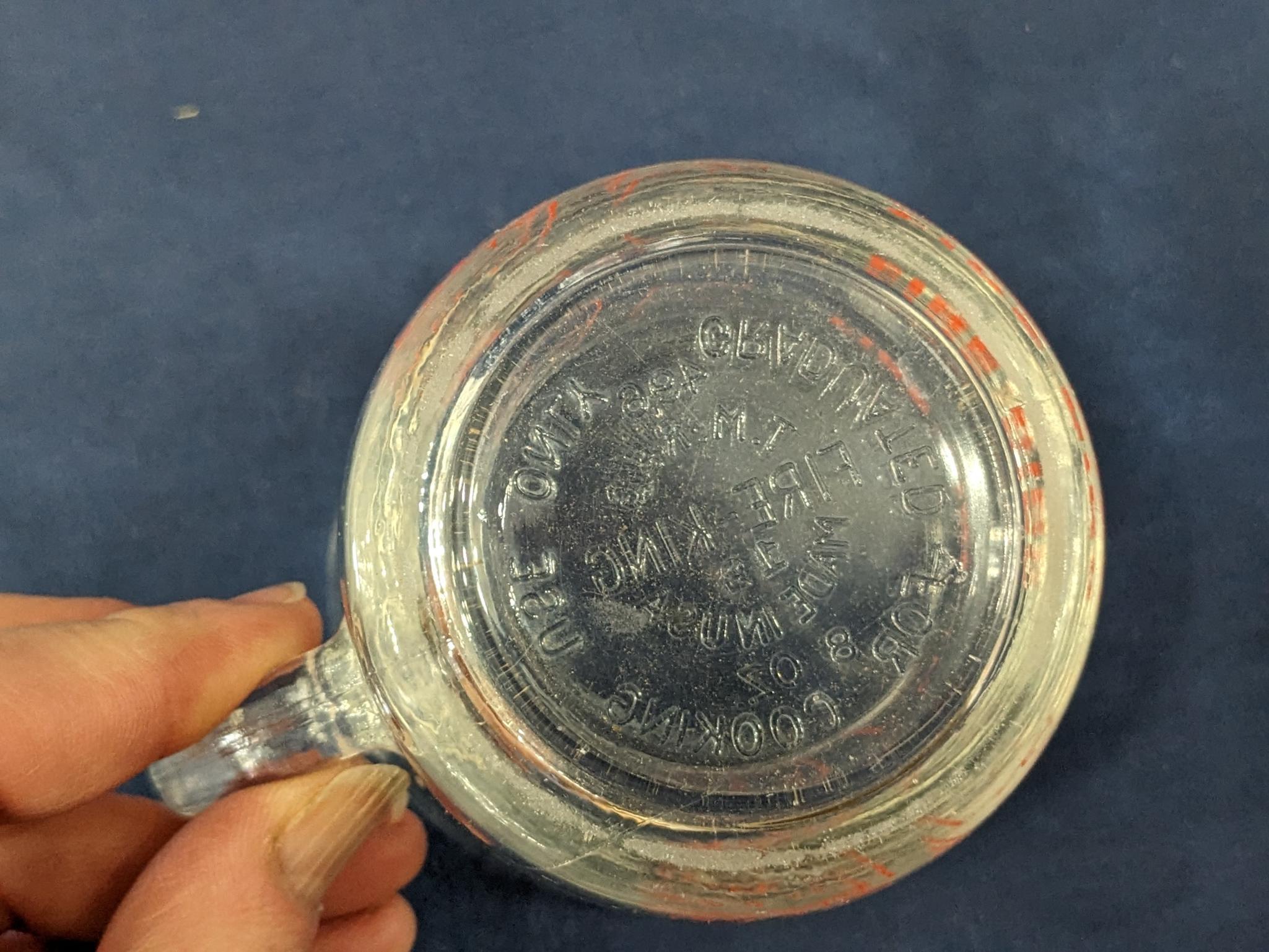 Set of 2 Fire King glass measuring cups include a 1 cup and 2 cup; larger measures 5" tall.