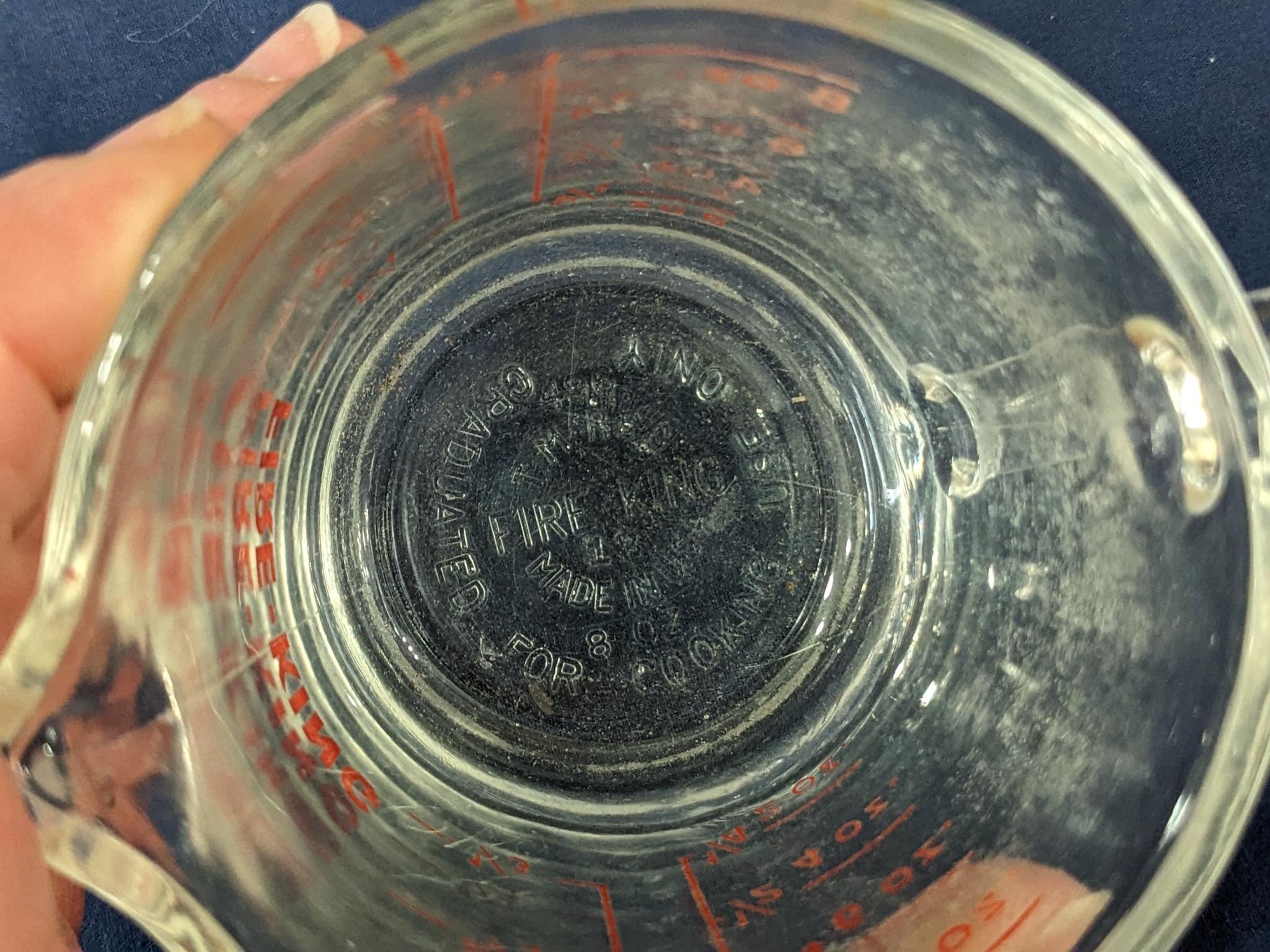 Set of 2 Fire King glass measuring cups include a 1 cup and 2 cup; larger measures 5" tall.