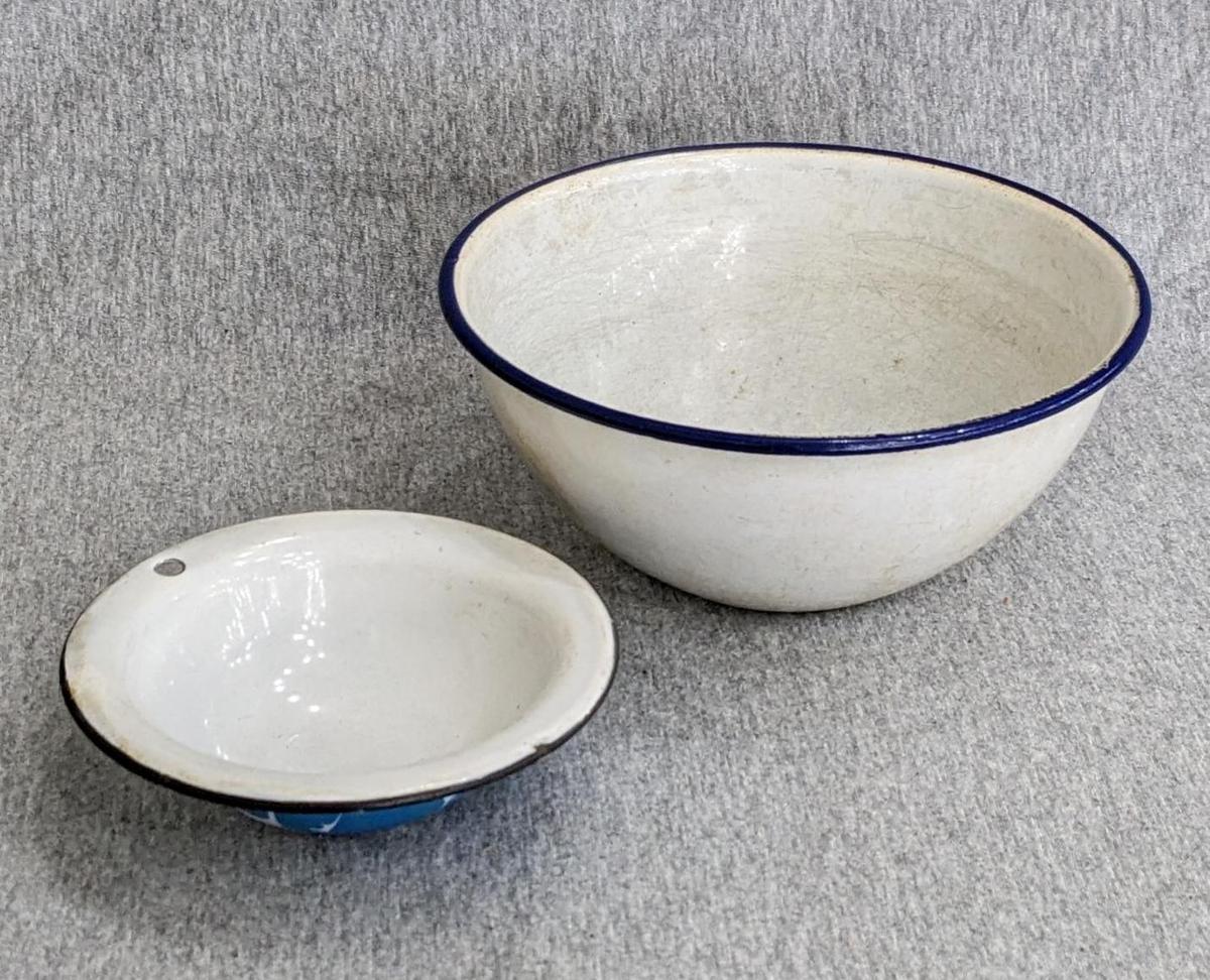 Two enamelware bowls; larger bowl measures 6" x 3". Smaller bowl has a beautiful blue and white