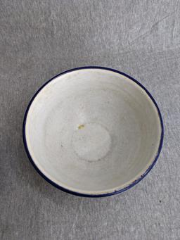 Two enamelware bowls; larger bowl measures 6" x 3". Smaller bowl has a beautiful blue and white